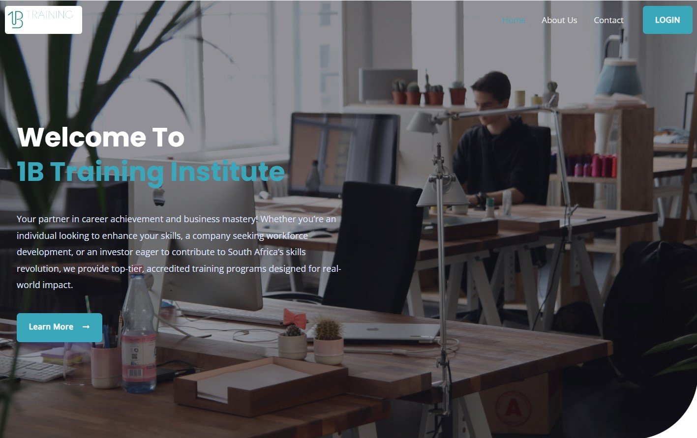 1B Training Institute welcome page with a man working at a desk