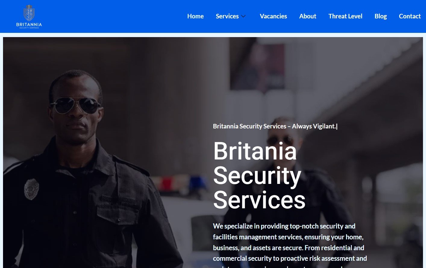 Britannia Security Services guard in uniform looking vigilant