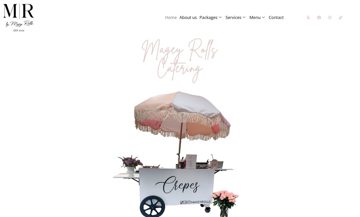 Magey Rolls catering cart with crepes sign and pink fringe umbrella